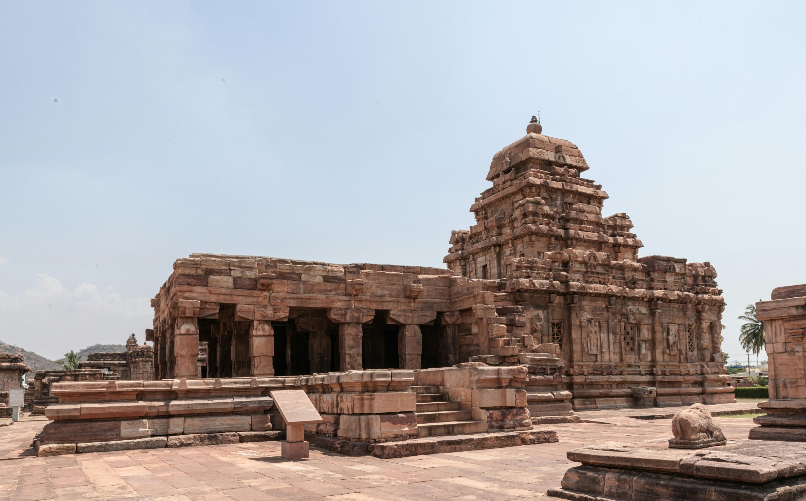 Explore the historical stone architecture of a temple in Pattadakal, Karnataka, India.